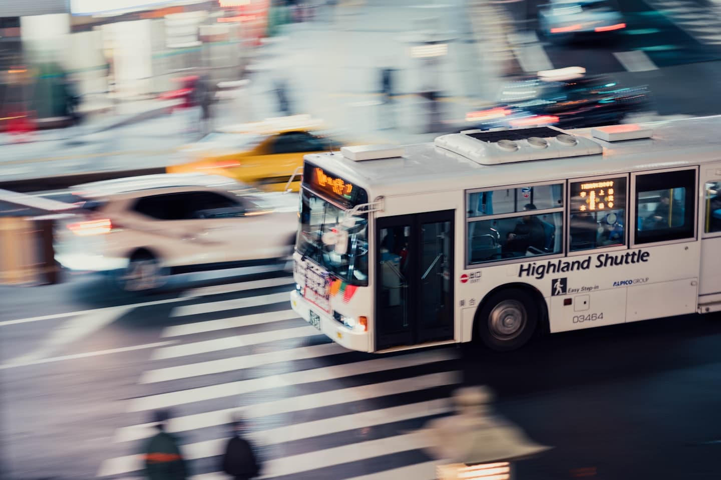 Public bus travelling through a city transit corridor